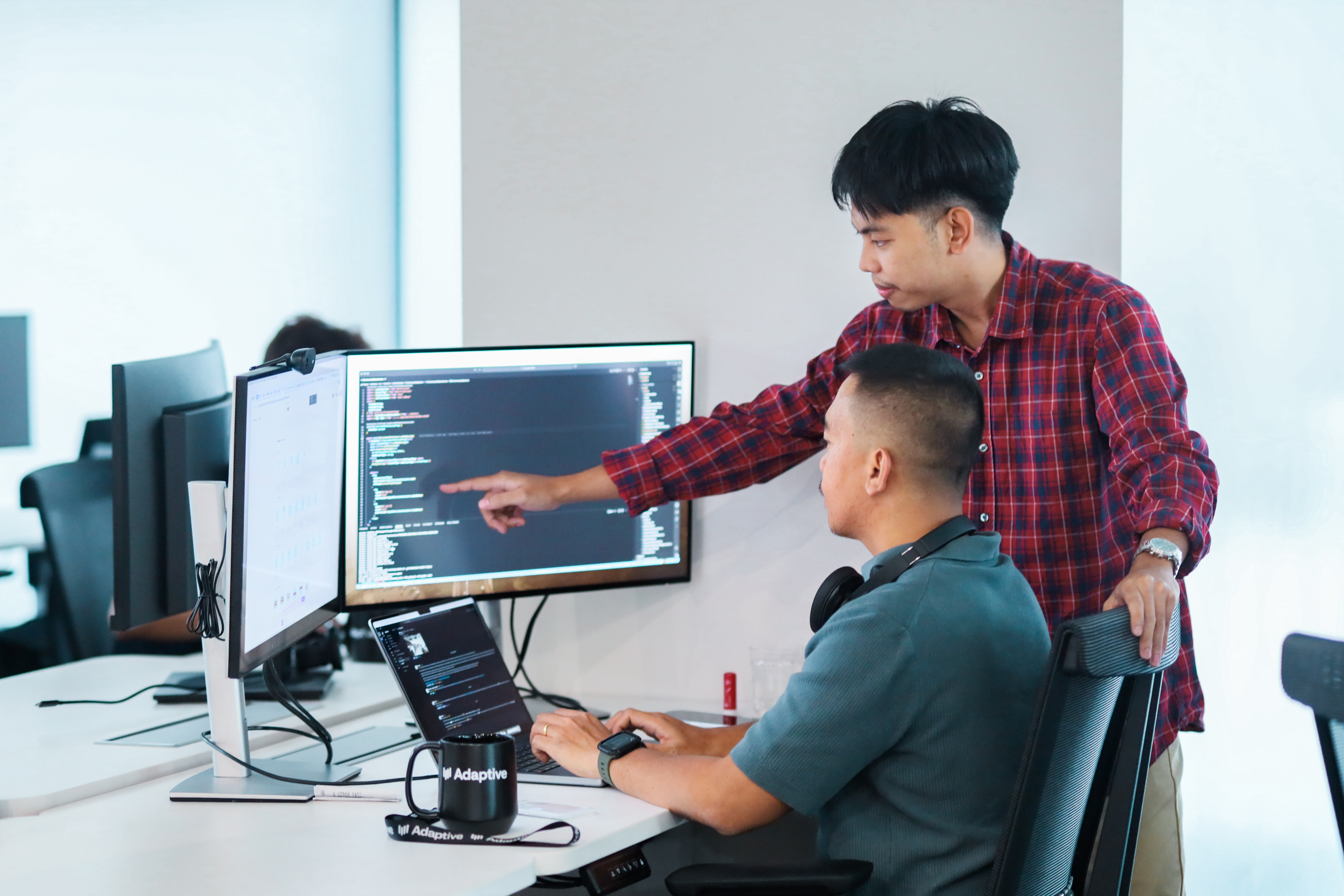 Two men working in Manila office